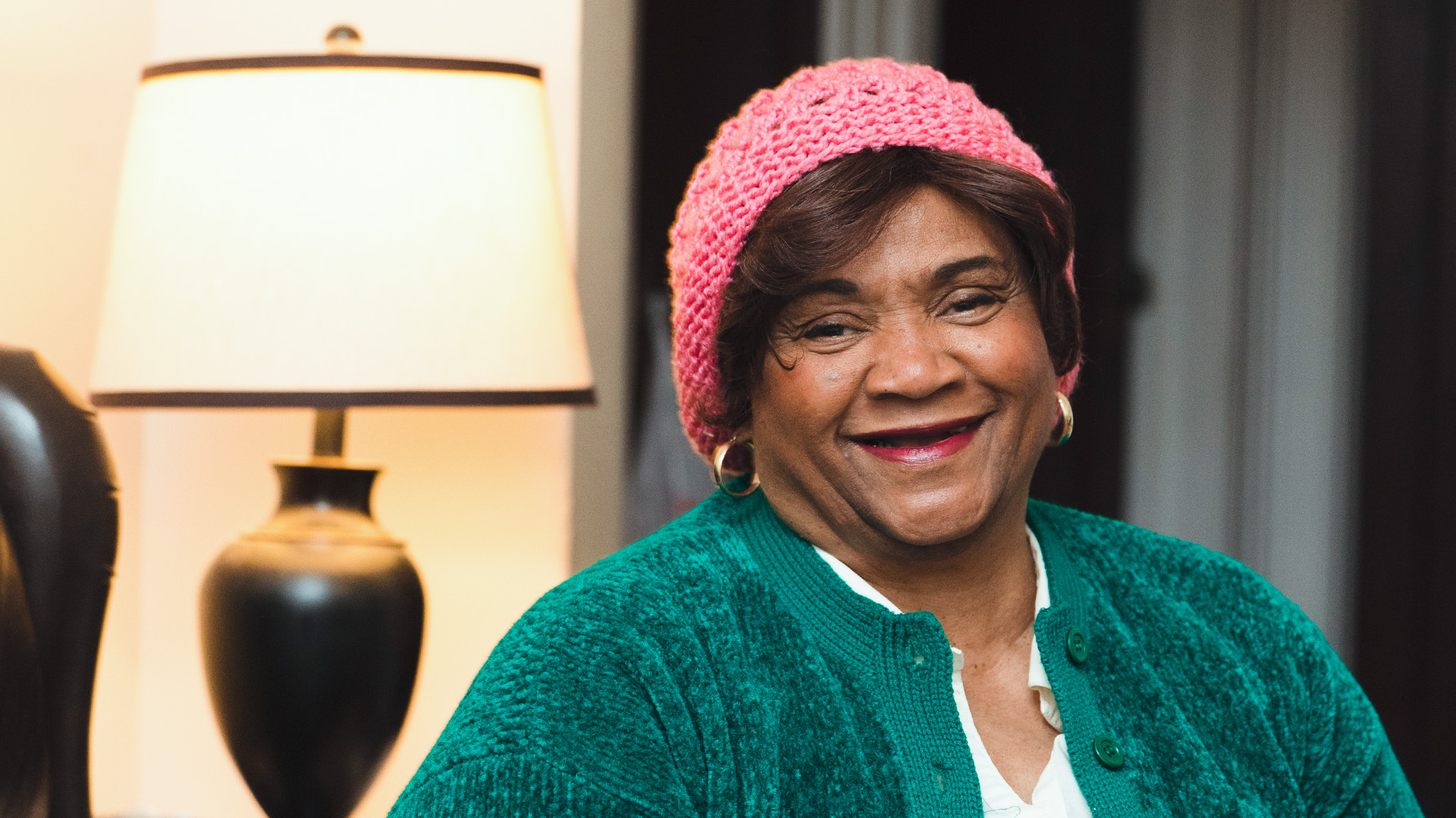 black older woman, seated, who is a client of the center for nyc neighborhoods' black homeownership project.